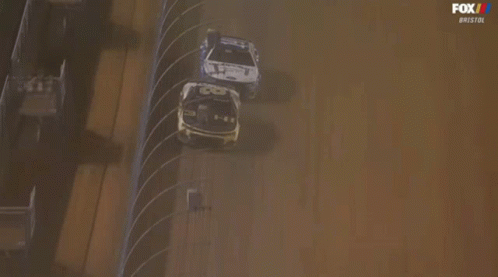 Race Car Going Around Track With Zmax Sign GIF