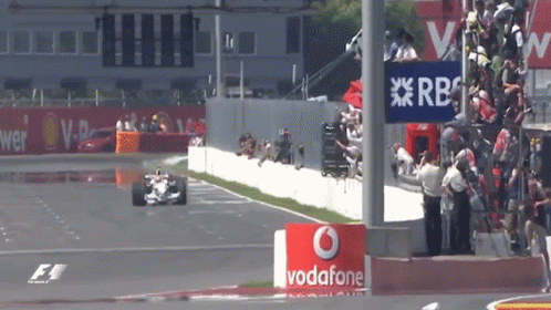 Race Car Going Down Track With Vodafone Sign GIF