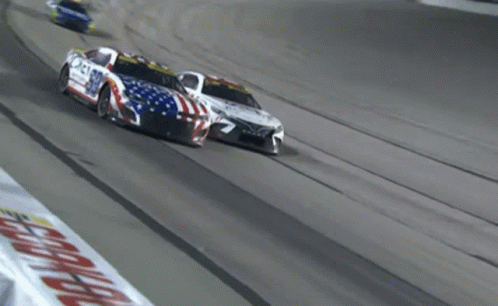 Race Car Number 99 Driving on Track