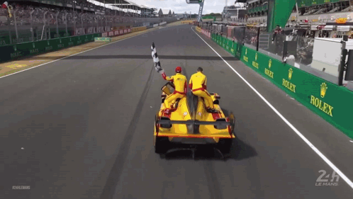 Race Car on Track With Rolex Ads