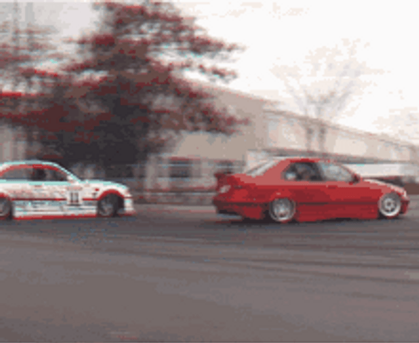 Race Cars Drifting On The Road GIF