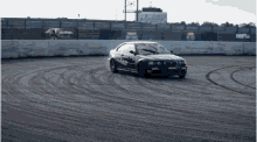 Race Cars Drifting Side By Side GIF
