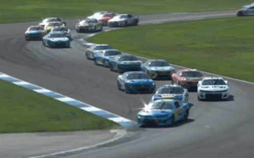 Race Cars Racing on Track With Number 5