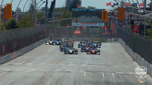 Racing Cars Going Down Track GIF