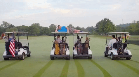 Racing Of Golf Cart In Field GIF