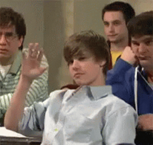 Justin Slowly Raising Hand Pick Me GIF