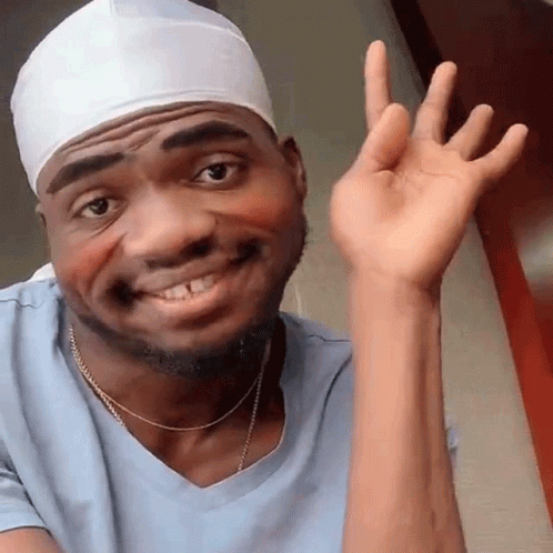 Shy Happy Guy Raising Hand GIF