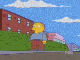 Ralph From The Simpsons Standing On Sidewalk