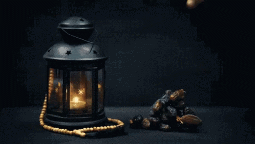 Ramadan Mubarak Lamp And Hand Picking Stone GIF