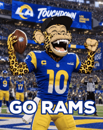 Rams Mascot Holding Football Touchdown Sign