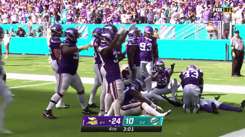Randy Moss Teammates Playful Scuffle Celebration GIF