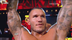Randy Orton Arms Up Biting Lips GIF