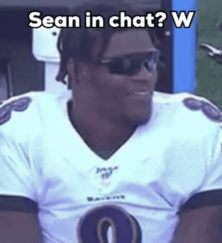 Ravens Football Player in Sunglasses and White Jersey