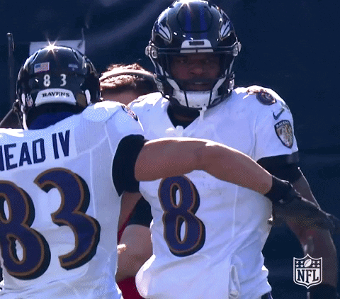Ravens Football Players Hugging