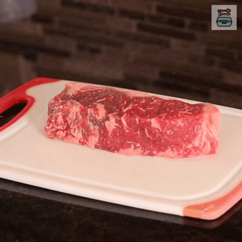Raw Meat on White Cutting Board