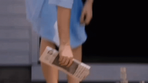 Ray Liotta Picking Up Newspaper GIF