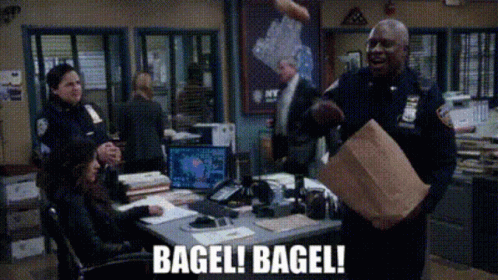 Raymond Holt With Team Having Bagel GIF