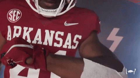 Razorbacks Football Player Flexing His Jersey GIF