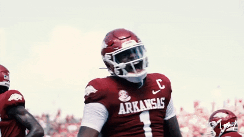 Razorbacks Player Smiling With Teammate GIF