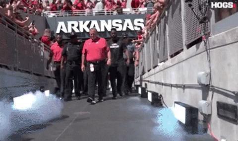Razorbacks Players Walking Out Of Stadium GIF