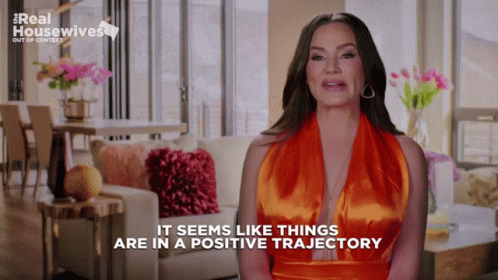 Real Housewives Woman in Orange Dress