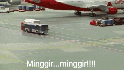 Red Airbus Towed by Bus on Tarmac