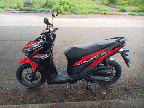 Red And Black Honda Scooter Parked GIF