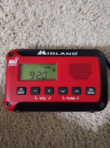 Red and Black Midland Radio Displaying 9:20