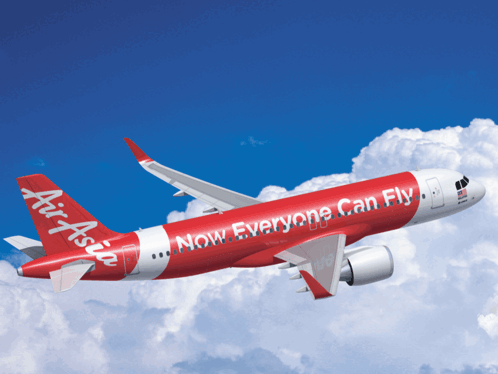 Red and White Air Asia Plane Flying