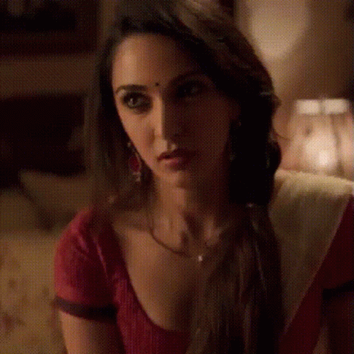 Red and White Dress Woman Looking at Camera