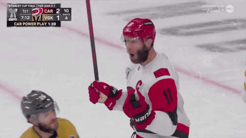 Red and White Hockey Player Number 11