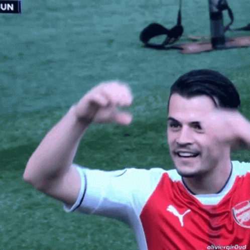 Red and White Puma Jersey Soccer Player Smiling