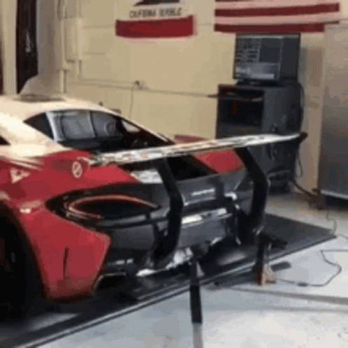 Red and White Sports Car in Garage