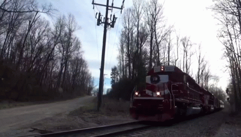 Red and White Train With JCT Sign