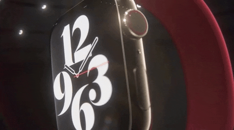 Red Apple Watch Displaying Digital Clock Closeup GIF