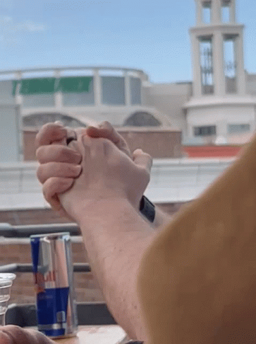 Red Bull Can With Two People Holding Hands GIF