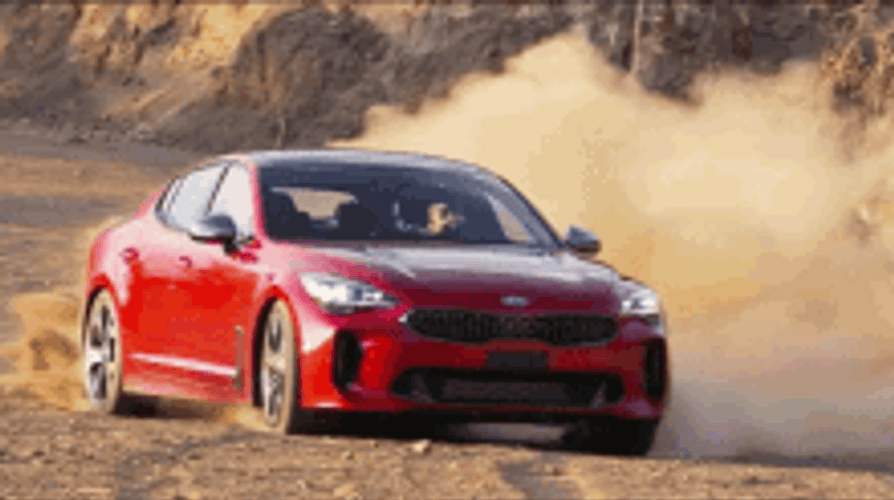 Red Car Drifting On The Dirt GIF