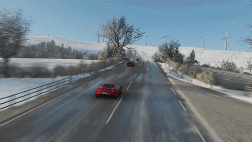 Red Car Driving on Snowy Road in Video Game