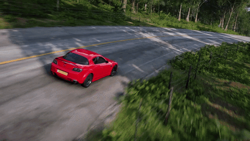 Red Car Driving With License Plate Saying A