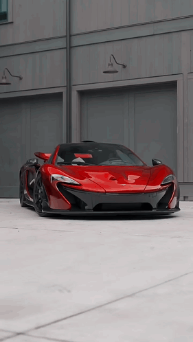 Red Car Parked in Front of Garage