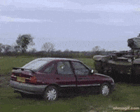 Red Car Parked in Grass Field