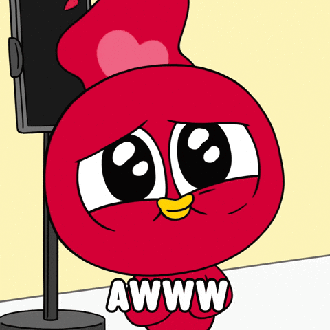 Red Cartoon Character with Heart on Head Saying Aww