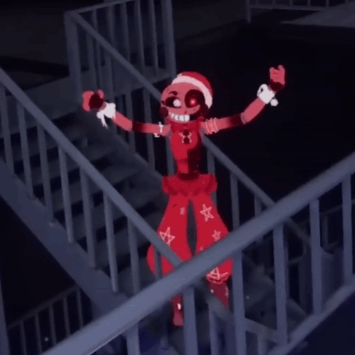 Red Cartoon Character With Santa Hat Standing on Railing
