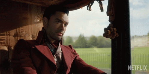 Red Coat Man In Car Netflix Logo GIF