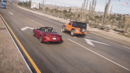 Red Convertible Driving Beside Jeep GIF