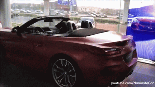 Red Convertible In Showroom With YouTube NamasteCar GIF