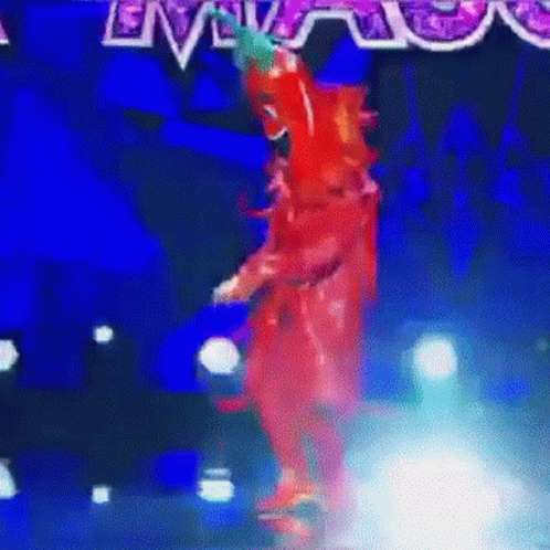Red Costume Dancer on Stage with Live Sign