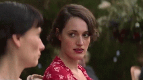 Red Dress Woman Looking at Camera with Another Woman