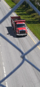 Red Dump Truck On The Road GIF