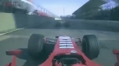 Red Ferrari Driving on Race Track